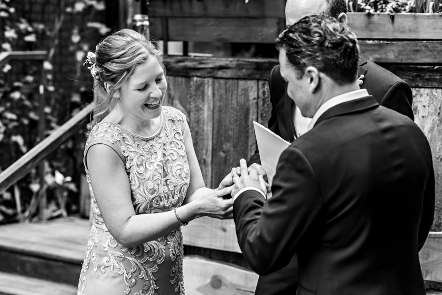 A bride and groom exchange rings.